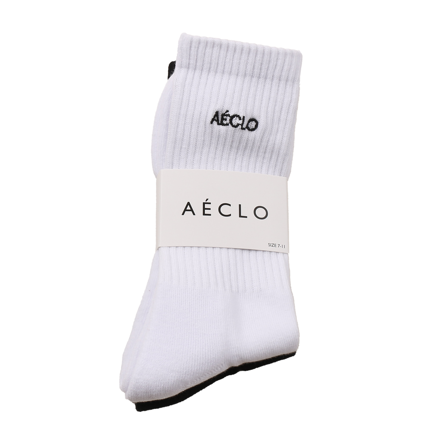 A pair of white AÉCLO socks with the brand's logo on the ankle, packaged in a simple white bag with the AÉCLO logo at the top.