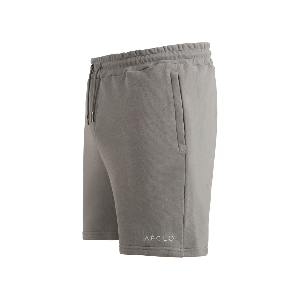 Gray shorts with a brand logo on a white background