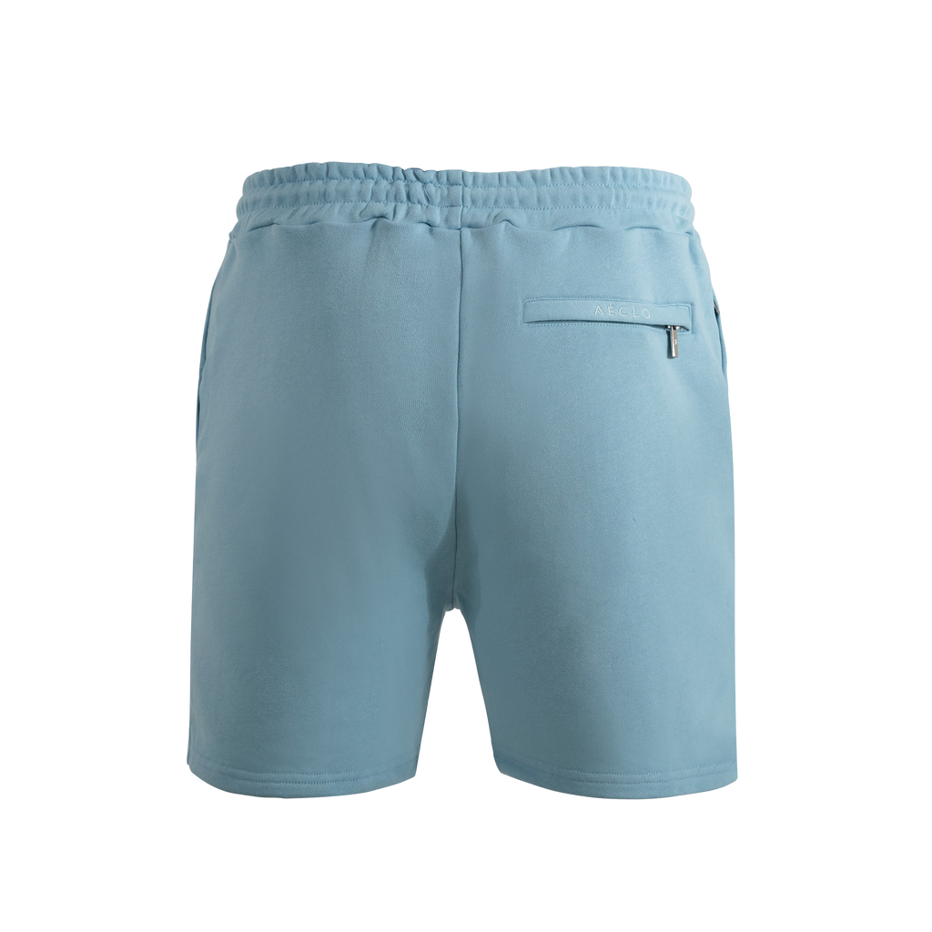 Light blue shorts with a pocket and zipper on a white background