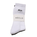 A pair of white AÉCLO socks with the brand's logo on the ankle, packaged in a simple white bag with the AÉCLO logo at the top.